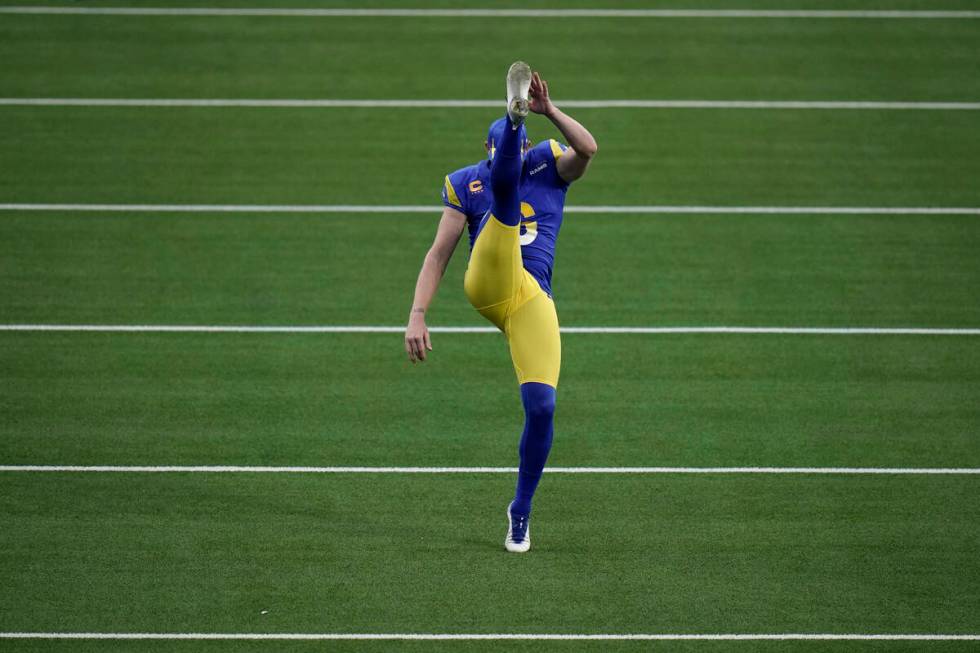 Los Angeles Rams punter Johnny Hekker warms up before an NFL wild-card playoff football game ag ...