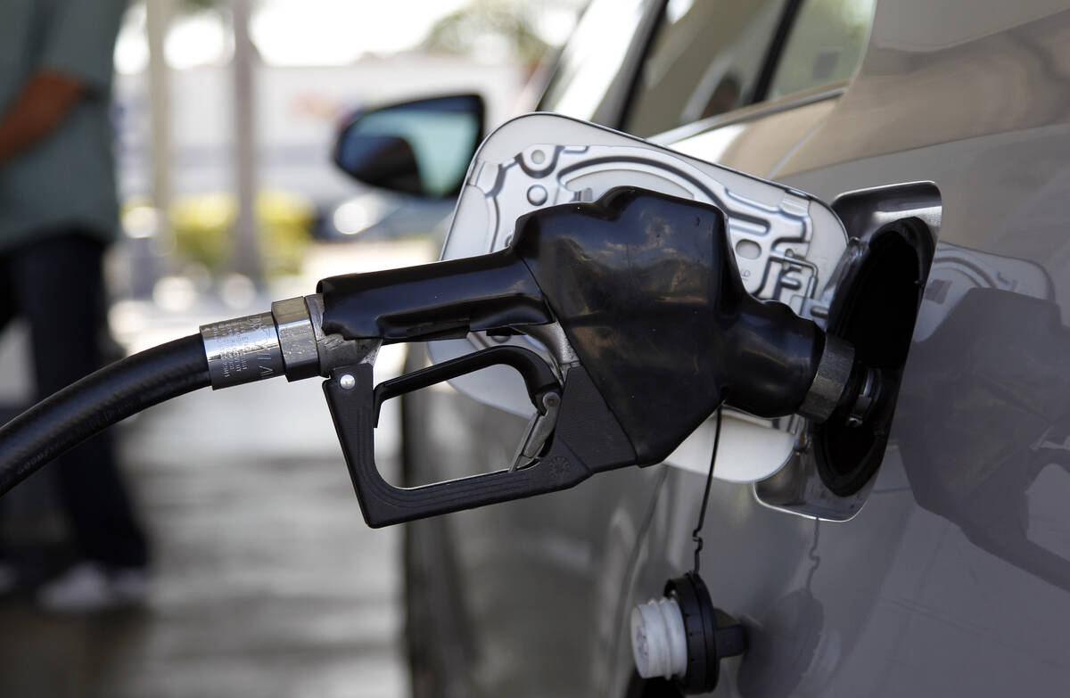 Fuel is pumped into a vehicle, Thursday, June 14, 2012, in Miami. (AP Photo/Lynne Sladky)