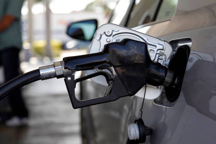Fuel is pumped into a vehicle, Thursday, June 14, 2012, in Miami. (AP Photo/Lynne Sladky)