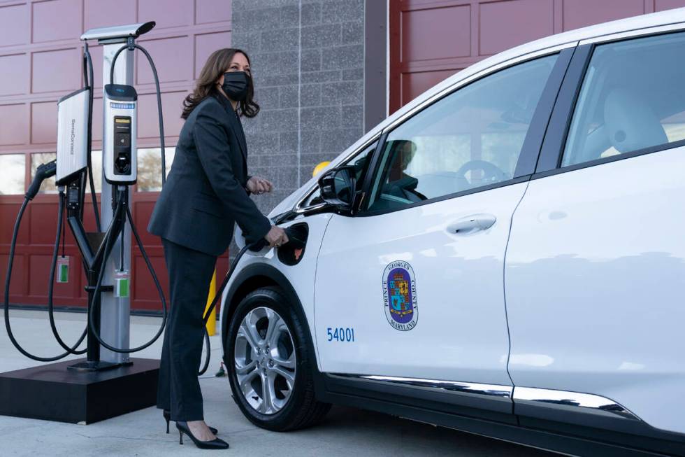 Vice President Kamala Harris charges an electric vehicle in one of the charging stations during ...