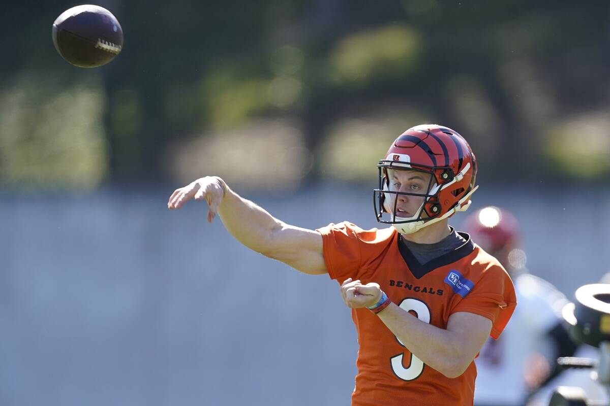 Cincinnati Bengals' Joe Burrow thorws during practice Thursday, Feb. 10, 2022, in Los Angeles. ...