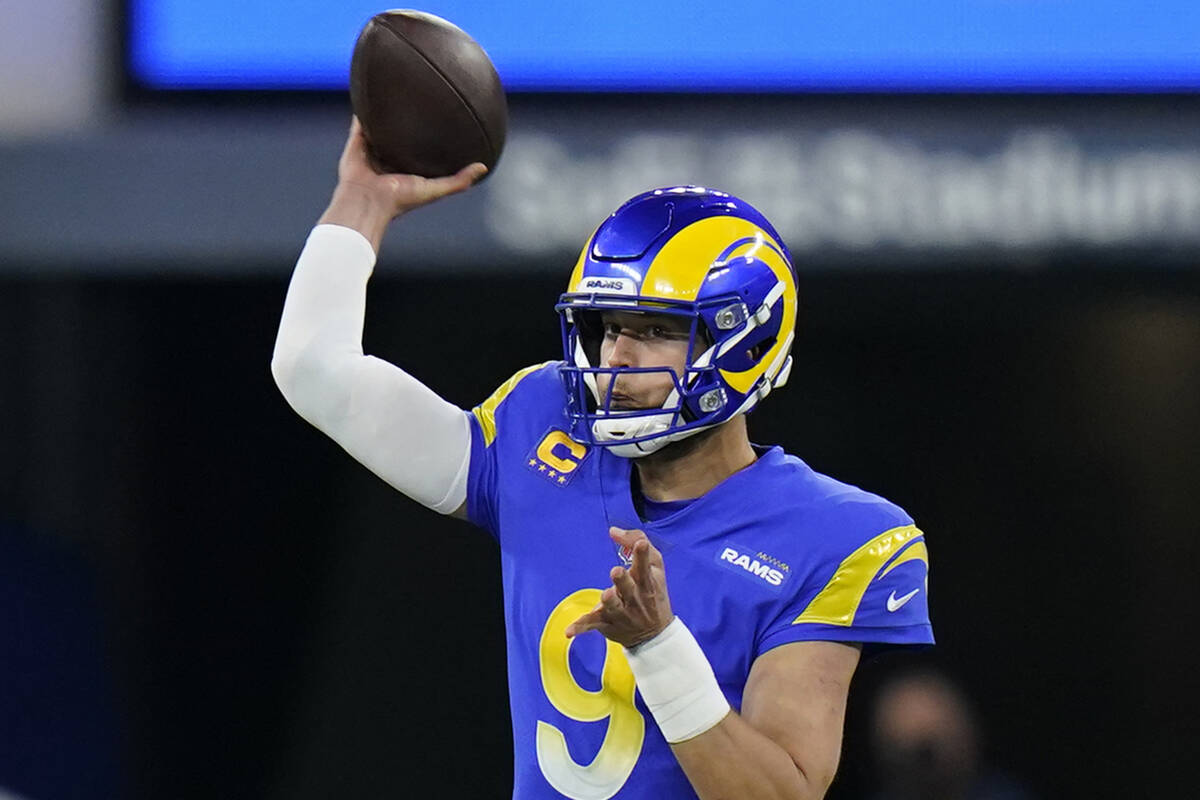 Los Angeles Rams quarterback Matthew Stafford passes against the Arizona Cardinals during the f ...