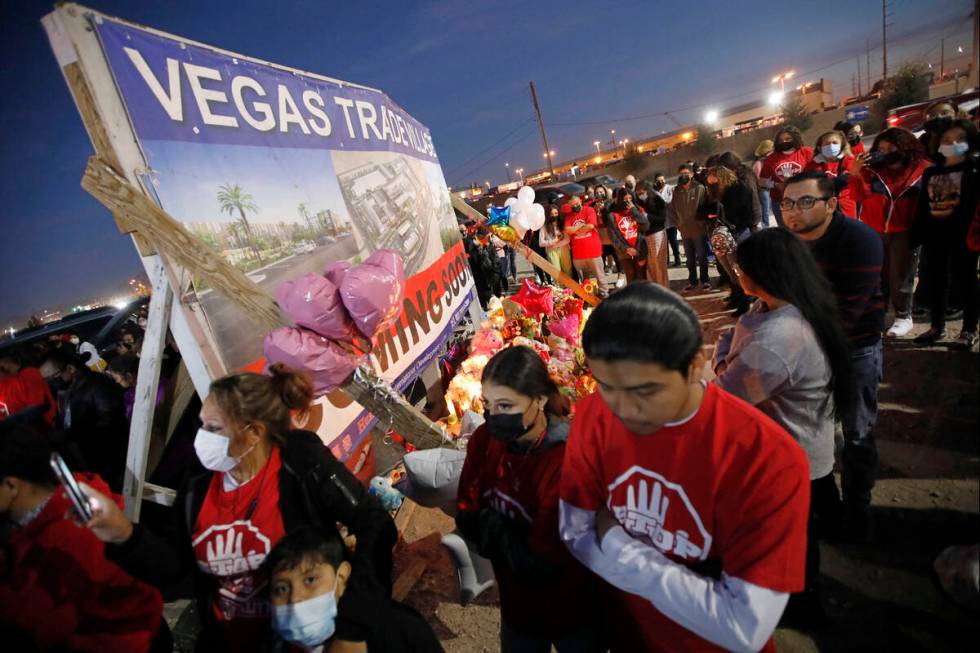 People gather for a vigil, Saturday, Feb. 5, 2022, in honor of the victims of a six-vehicle cr ...