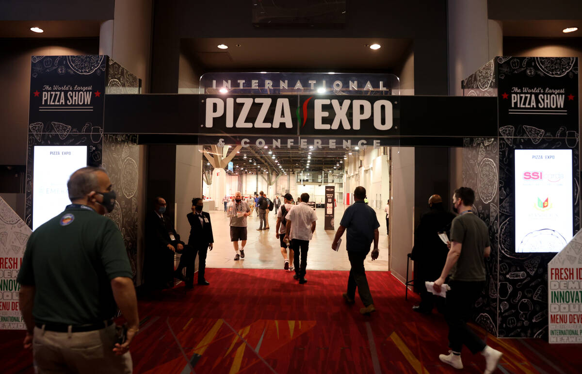 Conventioneers walk on the show floor for the International Pizza Expo at the Las Vegas Convent ...