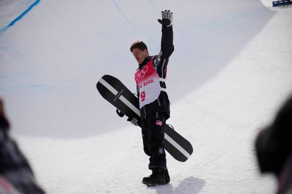 United States' Shaun White waves in the halfpipe course after the men's halfpipe finals at the ...