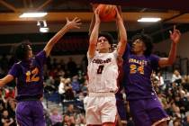 Durango High School's Mason Brown (12) and Durango High School's Taj Degourville (24) stop Coro ...