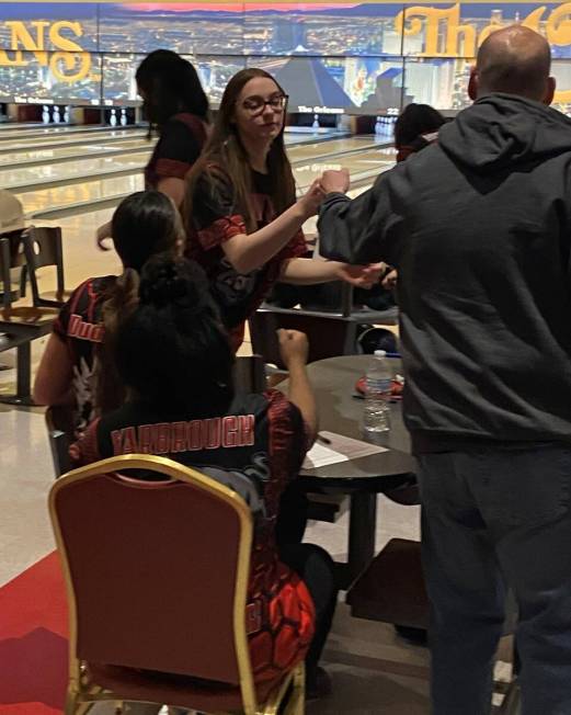 Arbor View's Mya Van Ryne fist-bumps coach Matt Kranz after a strike in the third game of a 7-2 ...