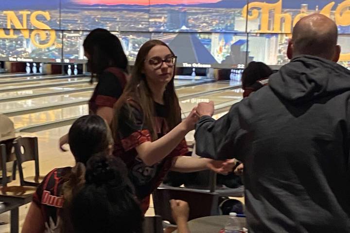 Arbor View's Mya Van Ryne fist-bumps coach Matt Kranz after a strike in the third game of a 7-2 ...