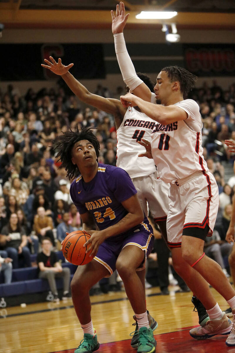 Durango High School's Taj Degourville (24) looks to pass against Coronado High School's Ron Jon ...