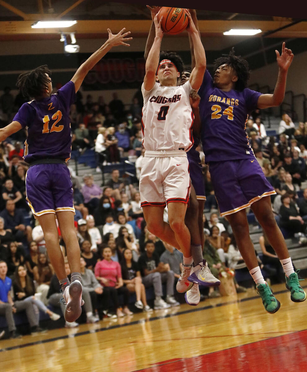 Durango High School's Mason Brown (12) and Durango High School's Taj Degourville (24) stop Coro ...