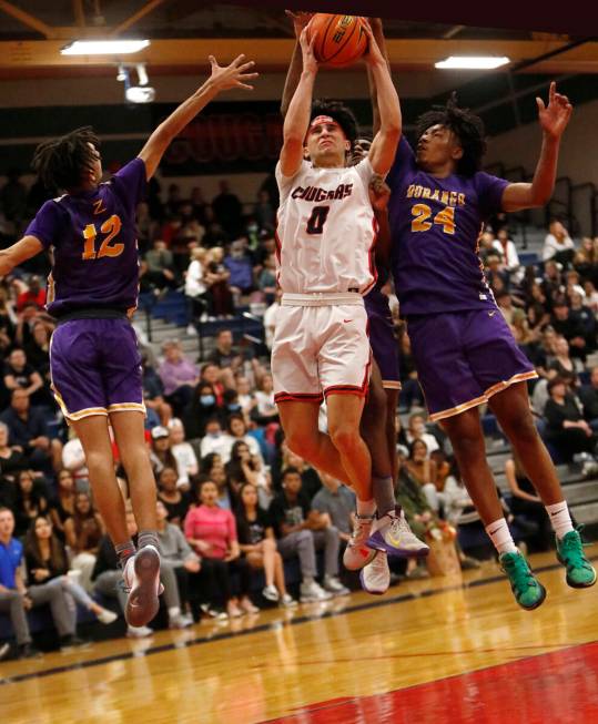 Durango High School's Mason Brown (12) and Durango High School's Taj Degourville (24) stop Coro ...