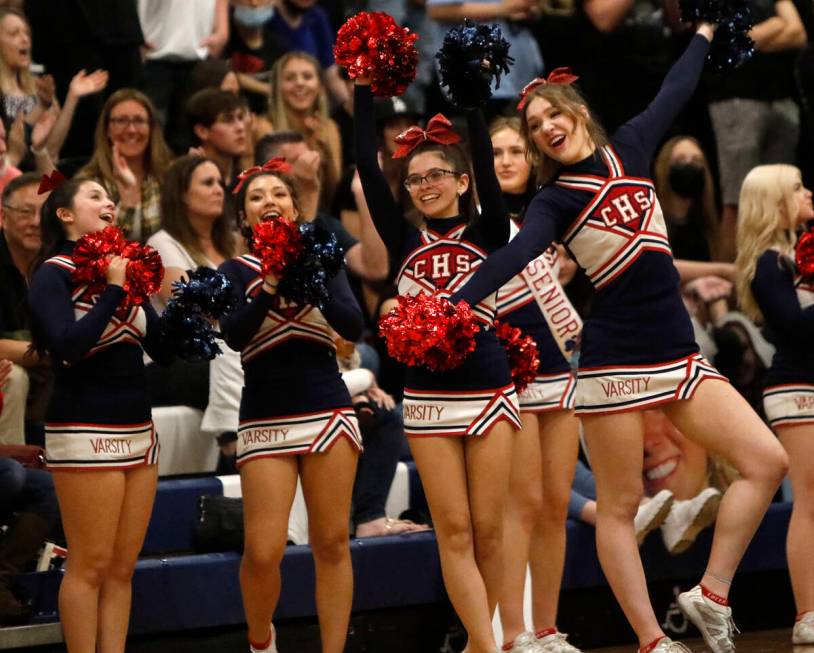 Coronado High School cheerleaders cheer during the second half of a basketball game at Coronado ...