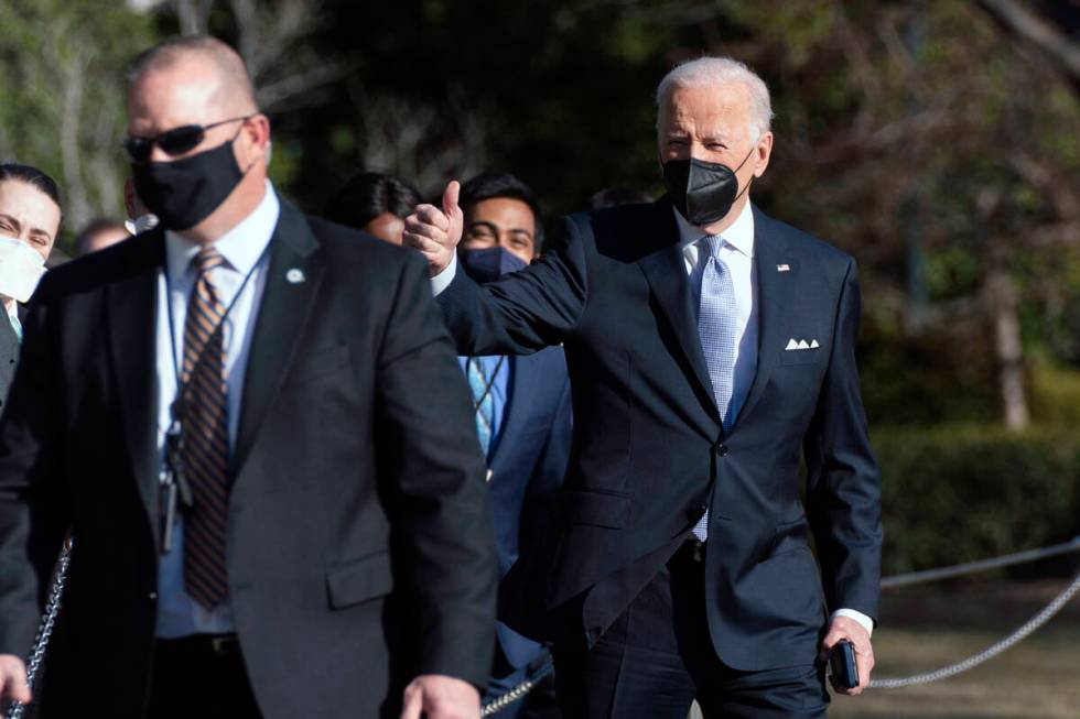 President Joe Biden gives a thumbs up as he walks to board Marine One on the South Lawn of the ...