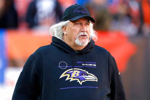 Baltimore Ravens inside linebackers coach Rob Ryan walks out to the field before an NFL footbal ...