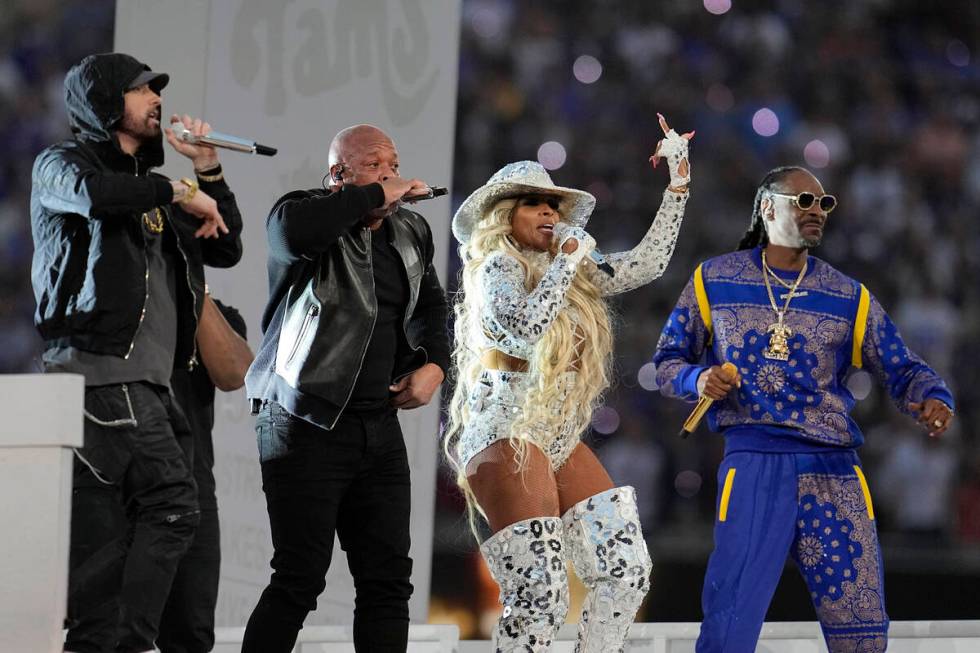 Eminem, from left, performs with Dr. Dre, Mary J. Blige and Snoop Dogg during halftime of the N ...