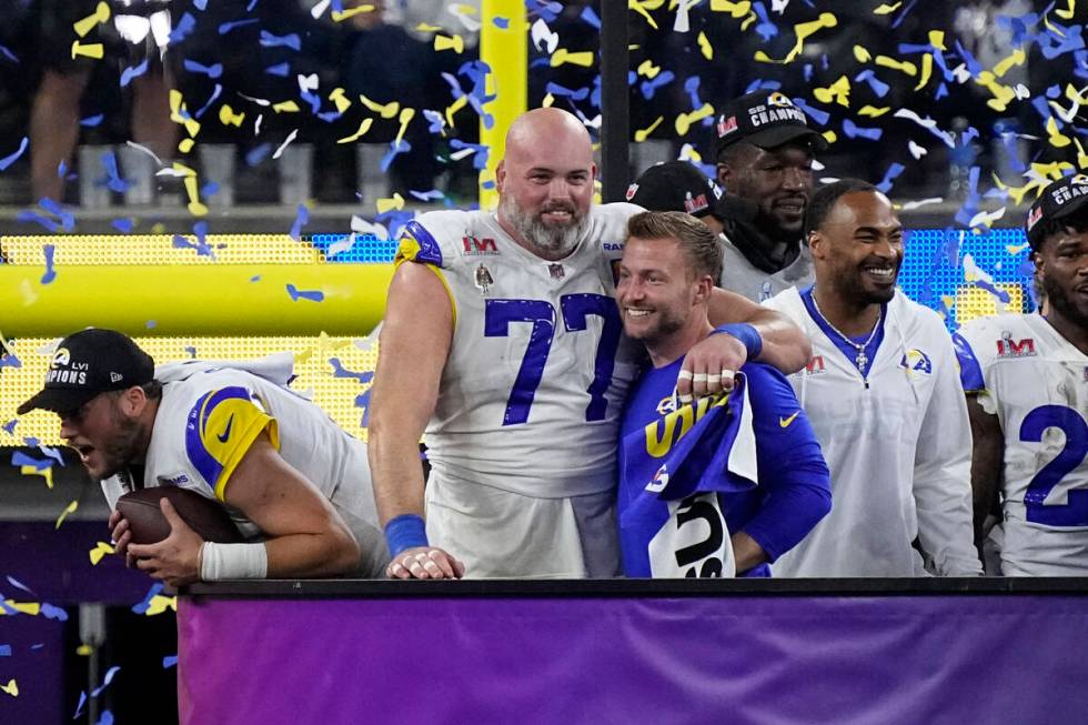 Los Angeles Rams head coach Sean McVay hugs offensive tackle Andrew Whitworth (77) after the NF ...