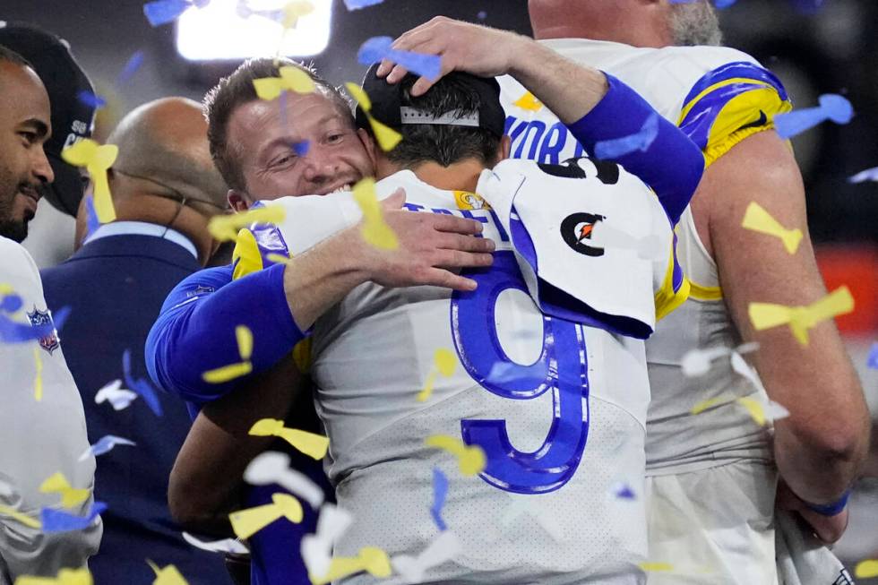 Los Angeles Rams quarterback Matthew Stafford (9) hugs head coach Sean McVay after the NFL Supe ...