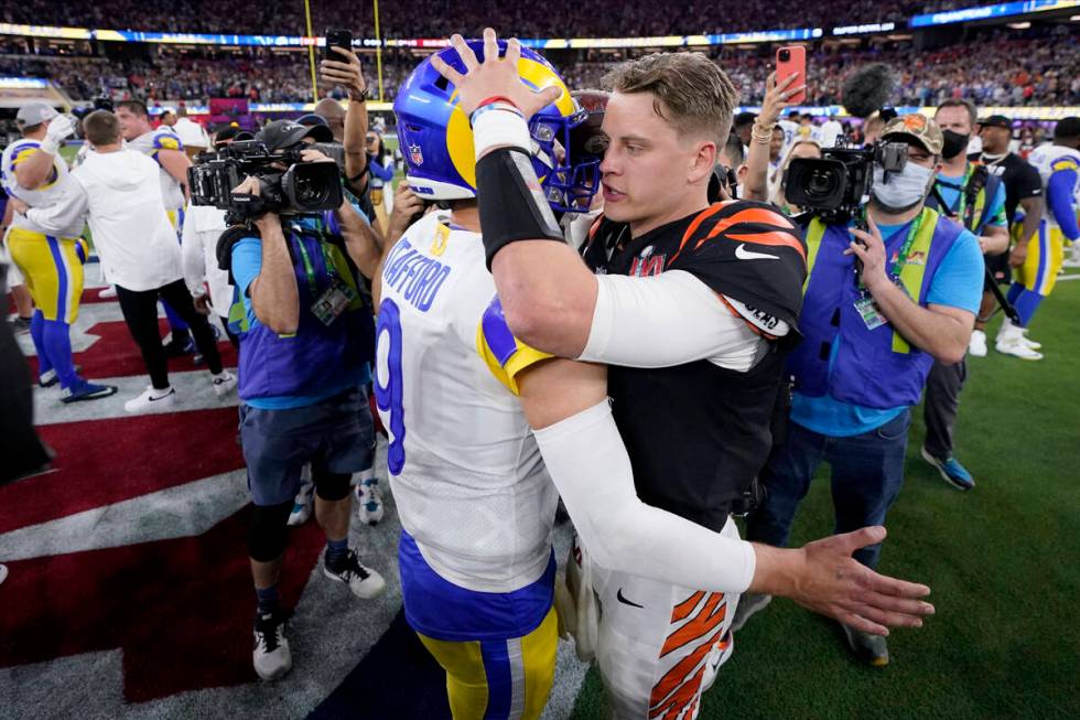Cincinnati Bengals quarterback Joe Burrow, right, congratulates Los Angeles Rams quarterback Ma ...