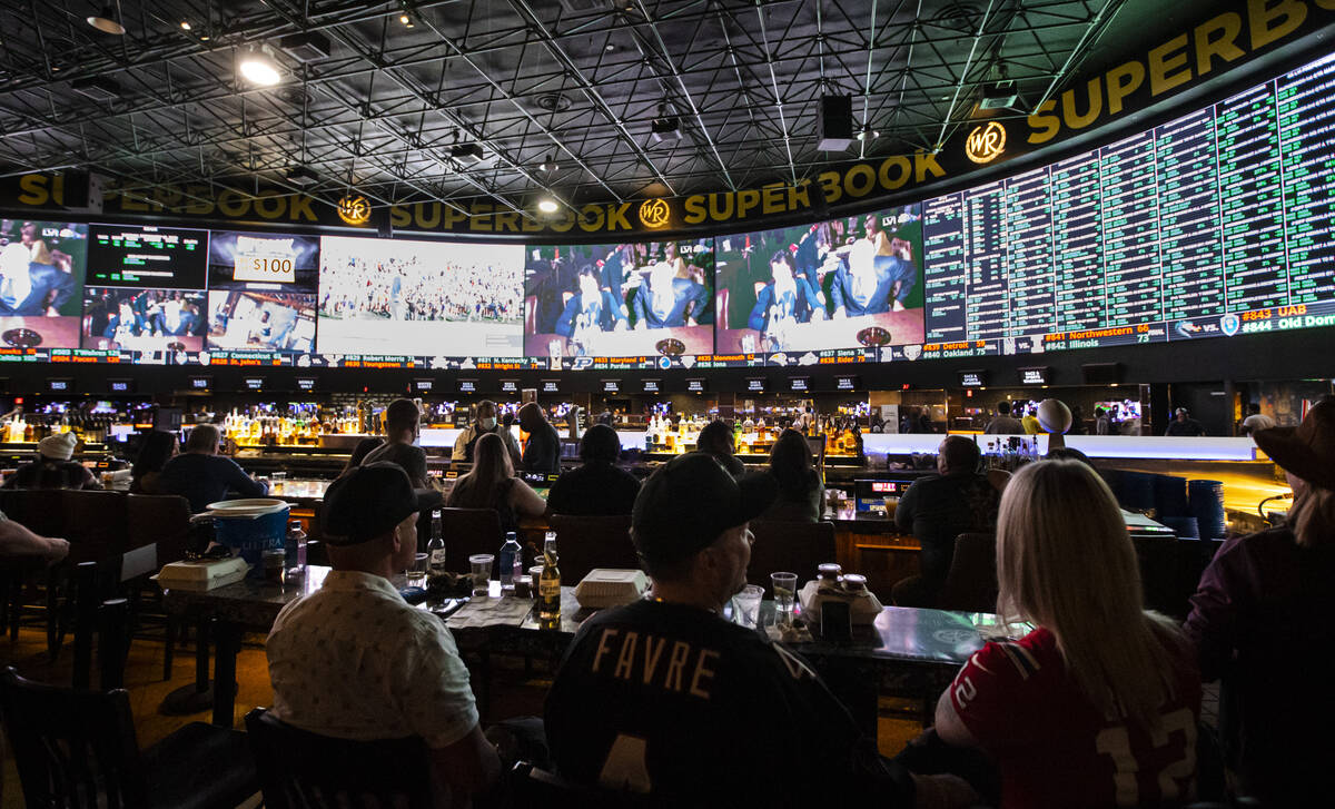 Attendees wait for the the Super Bowl to begin at a watch party at the Westgate SuperBook on Su ...