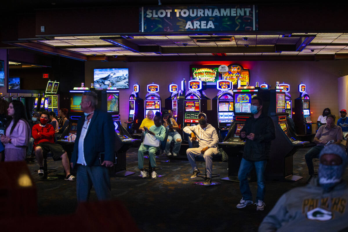 Attendees take in the action during a Super Bowl watch party at the Westgate SuperBook on Sunda ...