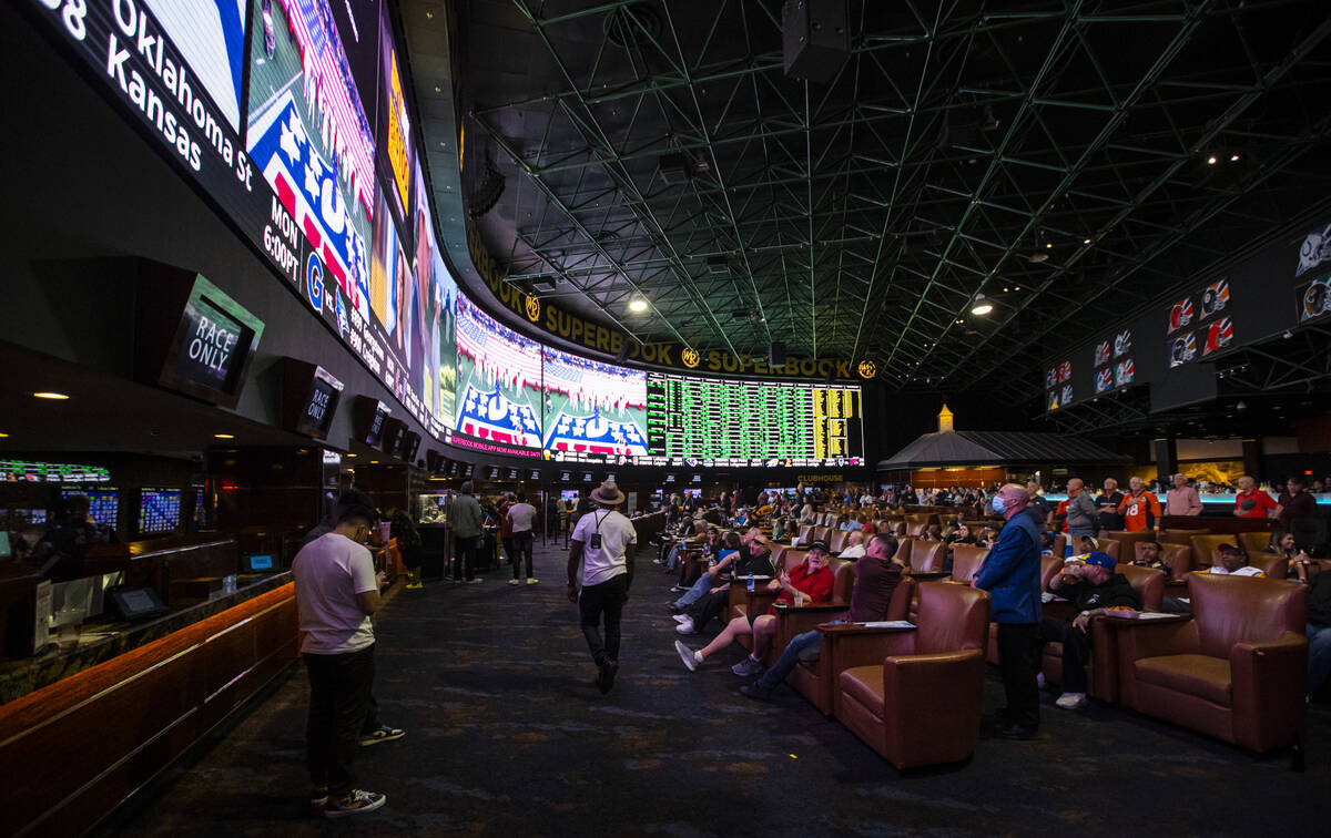 Attendees wait for the the Super Bowl to begin at a watch party at the Westgate SuperBook on Su ...