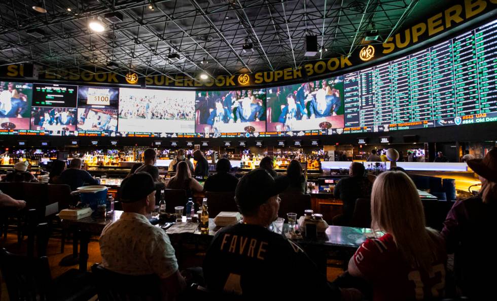 Attendees wait for the the Super Bowl to begin at a watch party at the Westgate SuperBook on Su ...