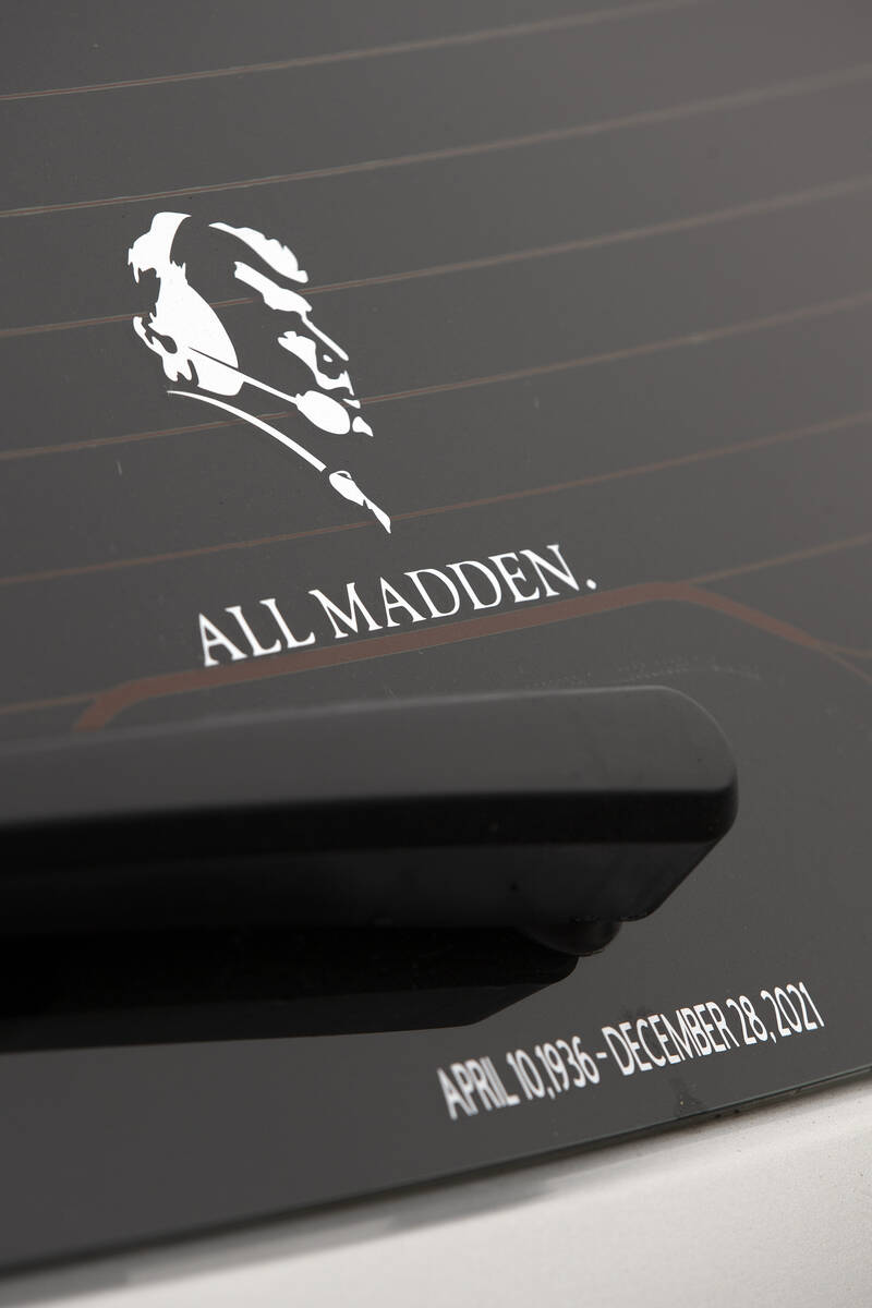 An Oakland Raiders fan's auto sports a decal commemorating former NFL football coach and televi ...
