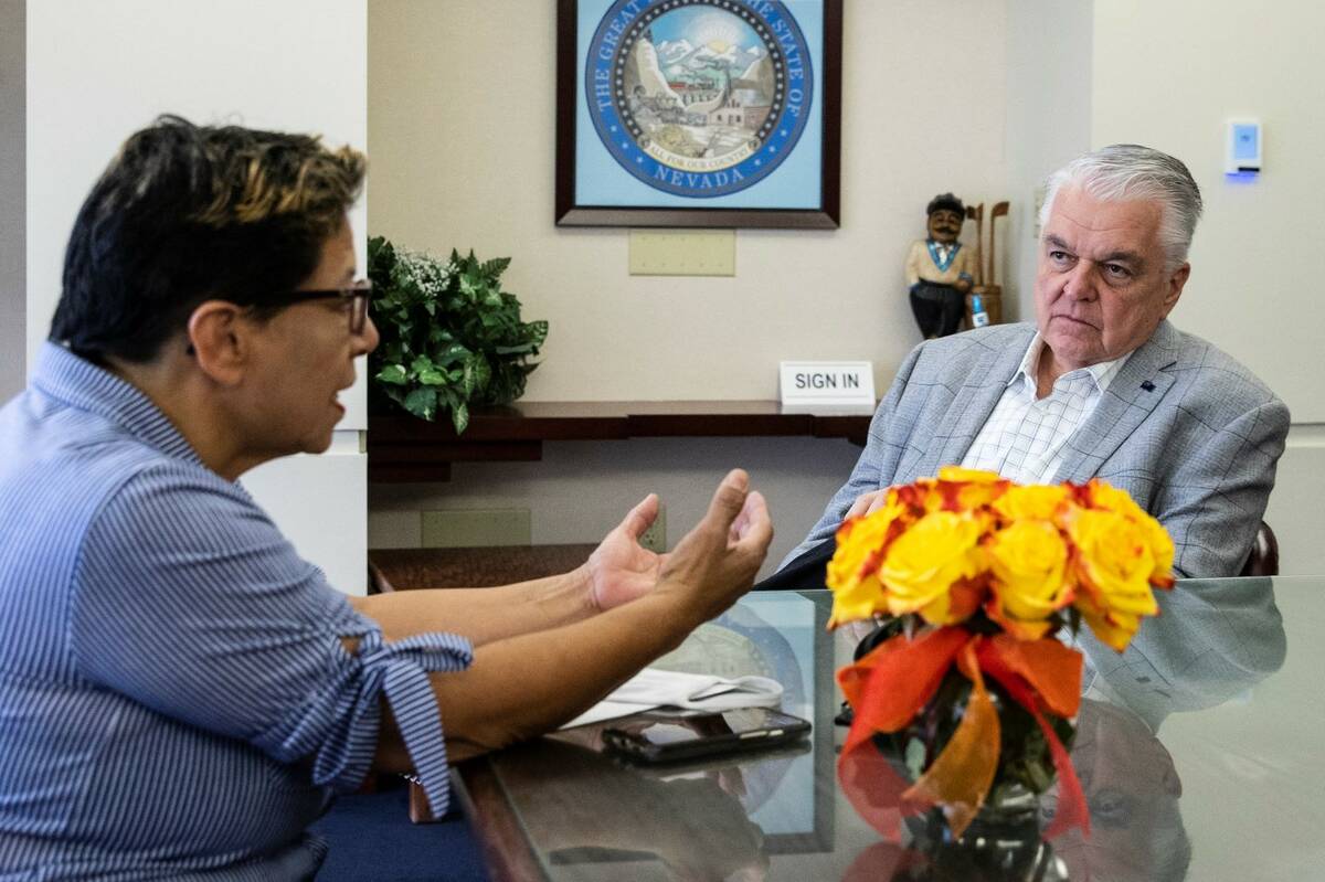 Irma Nunez, a personal care aid, talks to Gov. Steve Sisolak during their meeting at Grant Sawy ...
