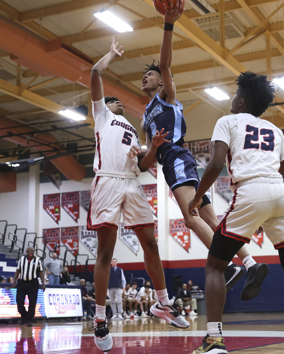 Canyon Springs' Bryant Legardy (2) shoots against Coronado's Darnell Fizer (5) during the secon ...