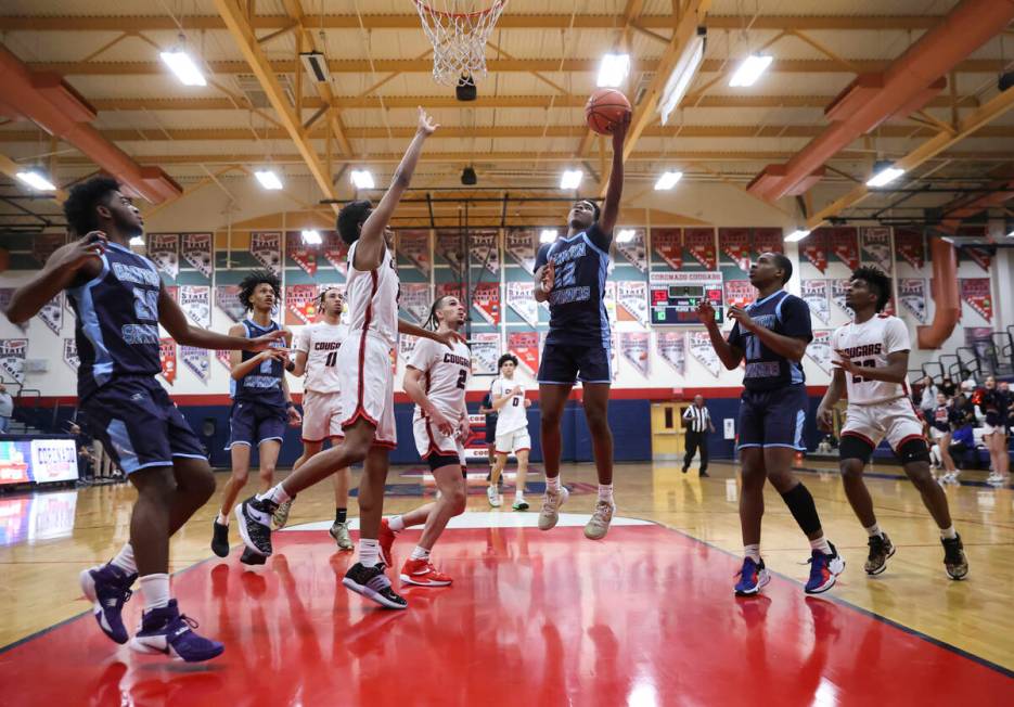 Canyon Springs' Jaylen Pollard (12) lays up the ball against Coronado during the second half of ...