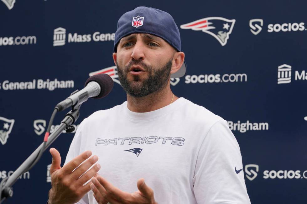 New England Patriots receivers coach Mick Lombardi faces reporters following an NFL football pr ...