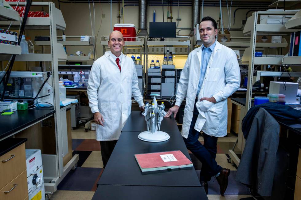 Dr. Jefferson Kinney, left, and Dr. Aaron Ritter in the Transitional Biomarker Discovery Labora ...
