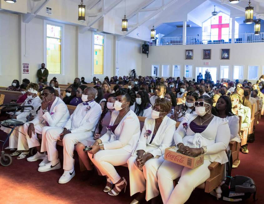 Mourners, including Cynthia Miller, second right, the mother of Tanaga Miller, one of 9 people ...