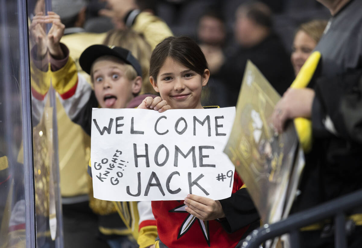 Fans of Golden Knights center Jack Eichel (9) watch him warm up before the start of an NHL hock ...