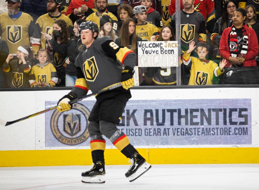 Fans of Golden Knights center Jack Eichel (9) watch him warm up before the start of an NHL hock ...