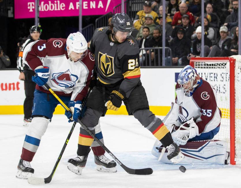 Golden Knights center Mattias Janmark (26) tries to redirect a shot past Colorado Avalanche goa ...