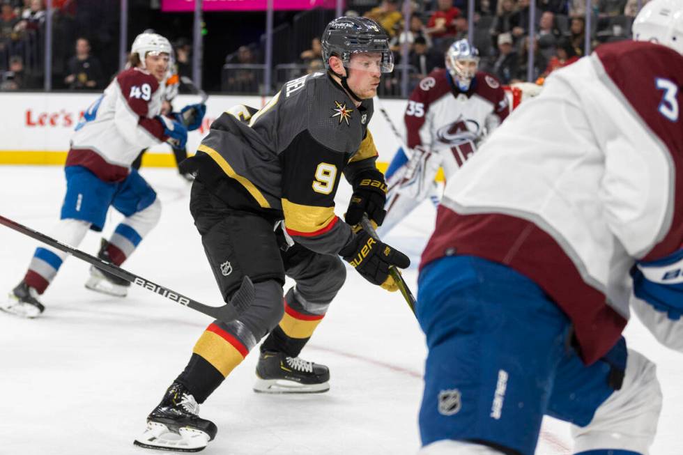 Golden Knights center Jack Eichel (9) sprints for a loose puck past Colorado Avalanche defensem ...