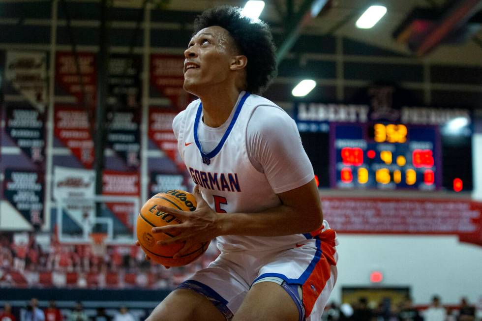 Bishop Gorman’s Darrion Williams (5) dips before shooting a layup against Liberty during ...