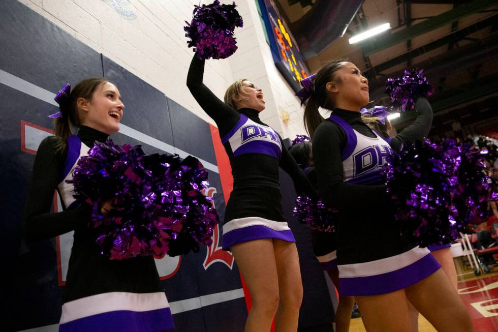Durango’s cheerleading team celebrate after their team scored a point during a high scho ...