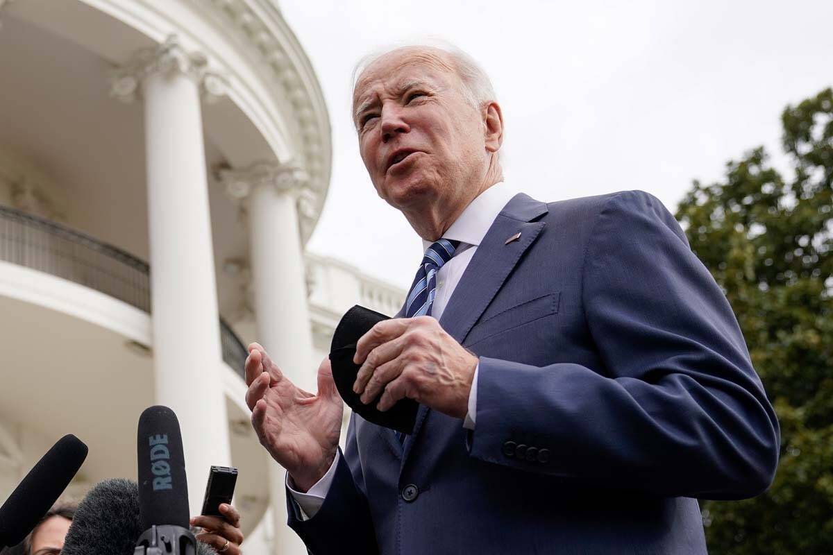 President Joe Biden speaks with members of the press before boarding Marine One on the South La ...