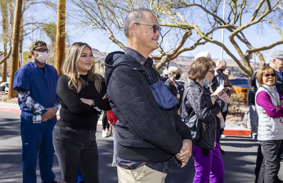 Former patient Alfred Abad, center, and his daughter Star are welcomed during a nondenomination ...