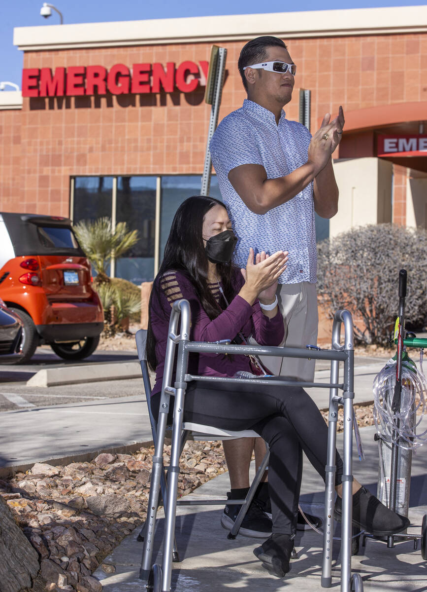 Newly released patient Kristen Miranda applauds with husband Preston during a nondenominational ...