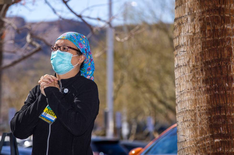 ICU Charge Nurse Arlice Rigodon listens intently as ICU Physician Ahmad during a nondenominatio ...