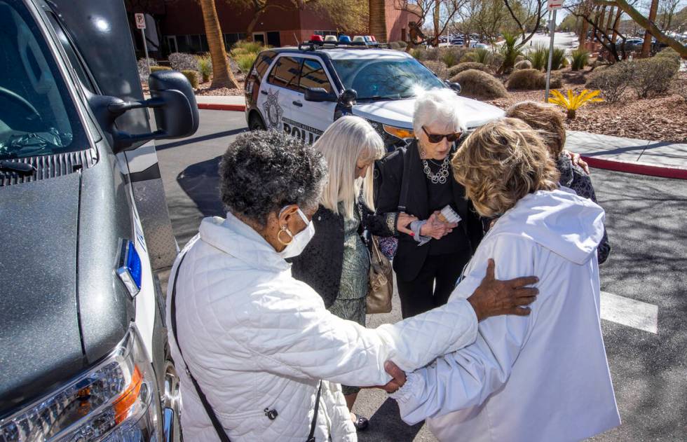 Attendees gather for a prayer circle during a nondenominational citywide prayer event happening ...