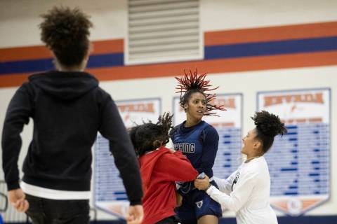 Spring Valley guard Aaliyah Gayles (3) celebrates with teammates after hitting a shot at the en ...
