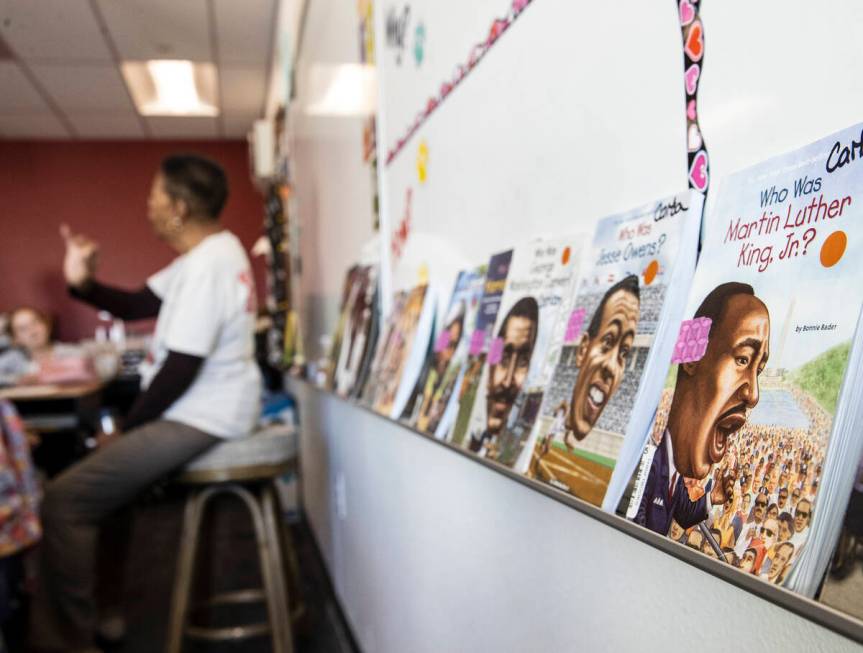 Books about civil rights activists, leaders, and famous black people, are displayed as Hannah B ...