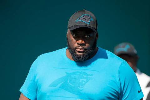 Carolina Panthers defensive line coach Frank Okam walks on to the field before an NFL football ...