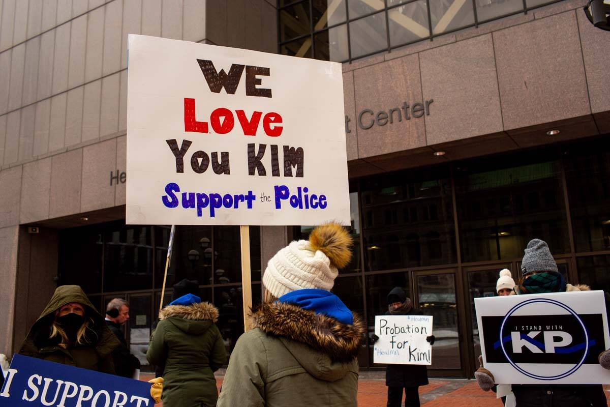 A group of demonstrators stand outside of Hennepin County Government Center calling for Kim Pot ...