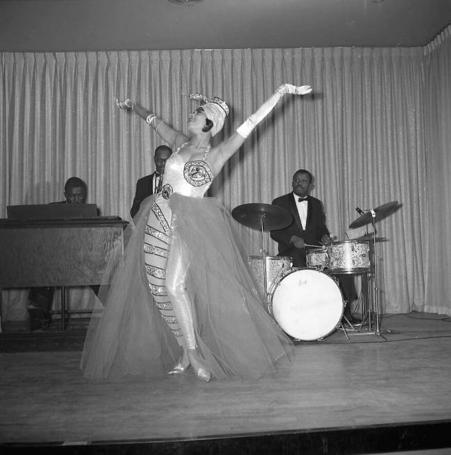 Diana Valdez, one of two dancers known as the ‘Exotic Twisters’, on stage in front of the b ...