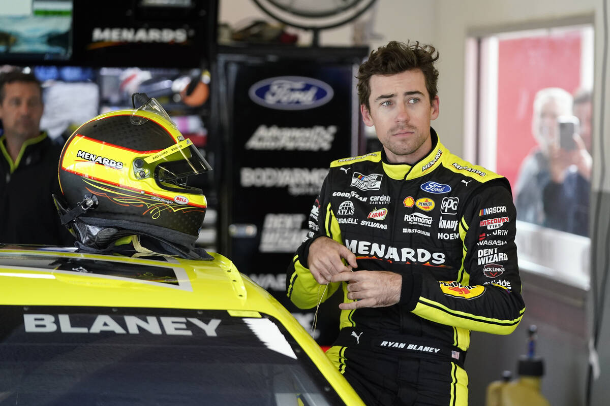 Ryan Blaney gets ready in his garage during a NASCAR auto race practice at Daytona Internationa ...